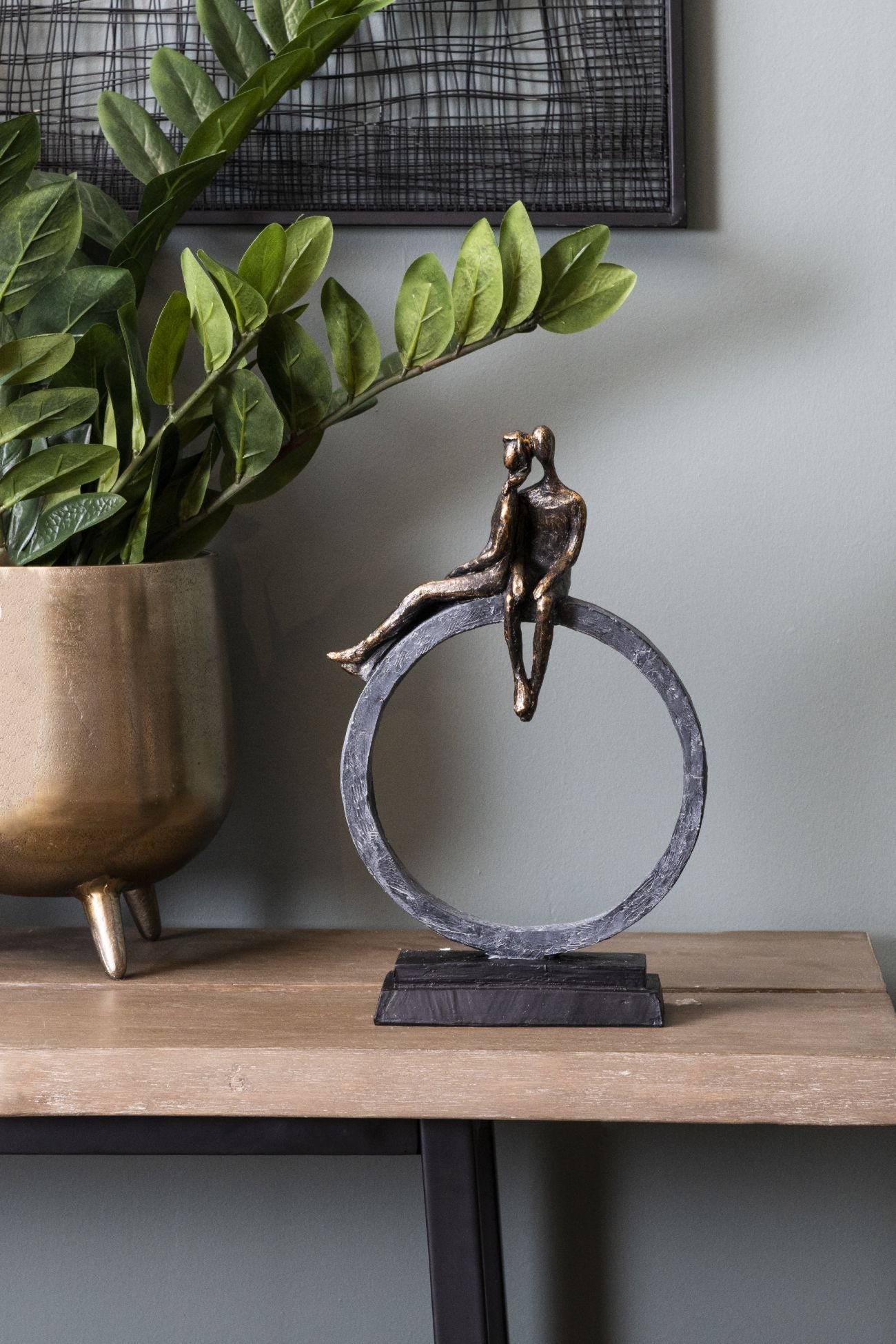 Sculpture of couple on loop base